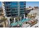 Resort-style pool and spa with palm trees and building view at 4381 W Flamingo Rd # 2016, Las Vegas, NV 89103