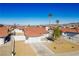 House with red tile roof, driveway, and small front yard, aerial view at 445 Concord Way, Henderson, NV 89015