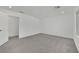 Bright bedroom with grey carpet and access to hallway at 5566 Erindale Terrace Ave, Las Vegas, NV 89141