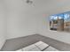 Bedroom with gray carpet, window, and city view at 5566 Erindale Terrace Ave, Las Vegas, NV 89141