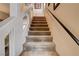 Carpeted staircase with neutral wall tones and simple railing at 6152 Sky River Ct, Las Vegas, NV 89118