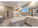 Elegant bathroom with double vanity, soaking tub, and shower at 695 Daylight Ridge Ct, Henderson, NV 89052