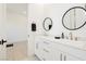 Double vanity bathroom with gold fixtures and view into a room at 818 Meyer May St, Las Vegas, NV 89138