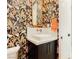 Stylish powder room with patterned wallpaper and gold accents at 818 Meyer May St, Las Vegas, NV 89138