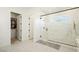 Spa-like bathroom with a large walk-in shower and walk-in closet at 818 Meyer May St, Las Vegas, NV 89138