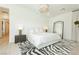Main bedroom with a king-size bed and a full-length mirror at 818 Meyer May St, Las Vegas, NV 89138