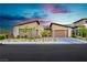 Luxury home exterior with modern design and landscaping at 818 Meyer May St, Las Vegas, NV 89138