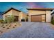 Modern home exterior, two-car garage, paver driveway at 818 Meyer May St, Las Vegas, NV 89138