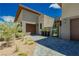 Modern home exterior with paver driveway and desert landscaping at 818 Meyer May St, Las Vegas, NV 89138