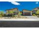 Modern home exterior, two-car garage, desert landscaping at 818 Meyer May St, Las Vegas, NV 89138