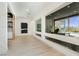 Light-filled hallway showcasing large windows and pool view at 818 Meyer May St, Las Vegas, NV 89138