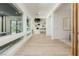 Bright hallway with light wood floors and views to backyard at 818 Meyer May St, Las Vegas, NV 89138