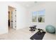 Bright home gym with wood-look floors and equipment at 818 Meyer May St, Las Vegas, NV 89138