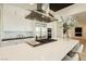 Modern kitchen with stainless steel appliances and white cabinetry at 818 Meyer May St, Las Vegas, NV 89138