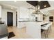 Modern kitchen with white cabinets and large island at 818 Meyer May St, Las Vegas, NV 89138