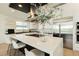 Modern kitchen with white cabinets and quartz countertops at 818 Meyer May St, Las Vegas, NV 89138