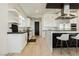 Modern kitchen with white cabinets and herringbone backsplash at 818 Meyer May St, Las Vegas, NV 89138