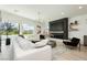 Spacious living room featuring a fireplace and large windows at 818 Meyer May St, Las Vegas, NV 89138