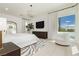 Spacious main bedroom with a large window and sitting area at 818 Meyer May St, Las Vegas, NV 89138