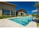 Clean lines and a beautiful pool with a modern house and landscaping at 818 Meyer May St, Las Vegas, NV 89138