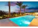Inviting swimming pool with landscape and night lighting at 818 Meyer May St, Las Vegas, NV 89138