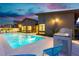 Stunning pool area with outdoor kitchen and seating at 818 Meyer May St, Las Vegas, NV 89138