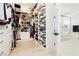 Large walk-in closet with ample shelving and drawers at 818 Meyer May St, Las Vegas, NV 89138