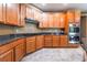 Kitchen boasts ample cabinetry and granite countertops at 8224 Chimney Bluffs St, North Las Vegas, NV 89085