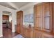 Kitchen with built-in cabinetry and wood shelving at 8426 Blackstone Ridge Ct, Las Vegas, NV 89139