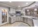 Modern kitchen with white cabinets, stainless steel appliances, and a large island at 9304 Angelfish Dr, Las Vegas, NV 89117