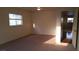 Bright bedroom with window and access to hallway at 10371 Calypso Cave St, Las Vegas, NV 89141