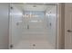 Large walk-in shower with a built-in seat at 10529 Parthenon St, Las Vegas, NV 89183