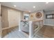 Upstairs hall with wood-look floors and access to bedrooms at 10529 Parthenon St, Las Vegas, NV 89183