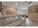 Upstairs hall with wood-look floors and decorative wall art at 10529 Parthenon St, Las Vegas, NV 89183