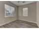 Well-lit bedroom with wood-look floors at 1067 Garden Cress Ct, Las Vegas, NV 89138