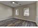 Bright bedroom with wood-look floors and neutral wall tones at 1067 Garden Cress Ct, Las Vegas, NV 89138