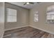 Well-lit bedroom featuring wood-look floors and neutral walls at 1067 Garden Cress Ct, Las Vegas, NV 89138