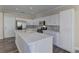 Modern kitchen with white cabinets and large island at 1067 Garden Cress Ct, Las Vegas, NV 89138