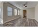 Bright and airy living room with wood-look floors at 1067 Garden Cress Ct, Las Vegas, NV 89138