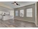 Open living area with kitchen view and wood floors at 1067 Garden Cress Ct, Las Vegas, NV 89138