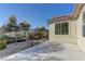 Spacious patio with gravel landscaping and access to the backyard at 1067 Garden Cress Ct, Las Vegas, NV 89138