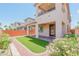 Private backyard with artificial turf and covered patio at 10718 Glowing Dawn Ave, Las Vegas, NV 89135