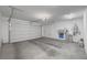 Attached garage with water softener and storage at 10718 Glowing Dawn Ave, Las Vegas, NV 89135