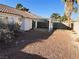 Backyard with gravel, a covered patio, and mature plants at 118 Queenswreath Dr, North Las Vegas, NV 89031