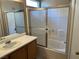 Bathroom with a shower/tub combo and wood vanity at 118 Queenswreath Dr, North Las Vegas, NV 89031