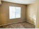 Simple bedroom with neutral walls and carpeted floors at 118 Queenswreath Dr, North Las Vegas, NV 89031