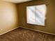 Well-lit bedroom with carpeted floors and window blinds at 118 Queenswreath Dr, North Las Vegas, NV 89031