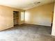 Spacious bedroom with carpeted floors and built-in shelving at 118 Queenswreath Dr, North Las Vegas, NV 89031