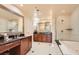 Elegant bathroom with double sinks, soaking tub, and shower at 145 E Harmon Ave # 2002, Las Vegas, NV 89109