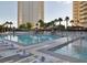 Inviting resort-style pool with spacious deck and lounge chairs at 145 E Harmon Ave # 2002, Las Vegas, NV 89109